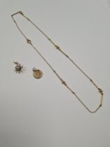 9ct yellow gold necklace with ball and bar spacers, 9ct gold St Christopher and 9ct gold pendant in