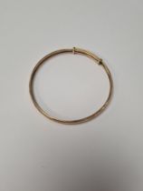 9ct yellow gold adjustable bangle, marked 385, approx 6.5cm diameter, approx 5g
