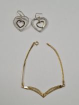 9ct yellow gold flat link bracelet with V shaped detail and pair of yellow metal earrings, set cubic