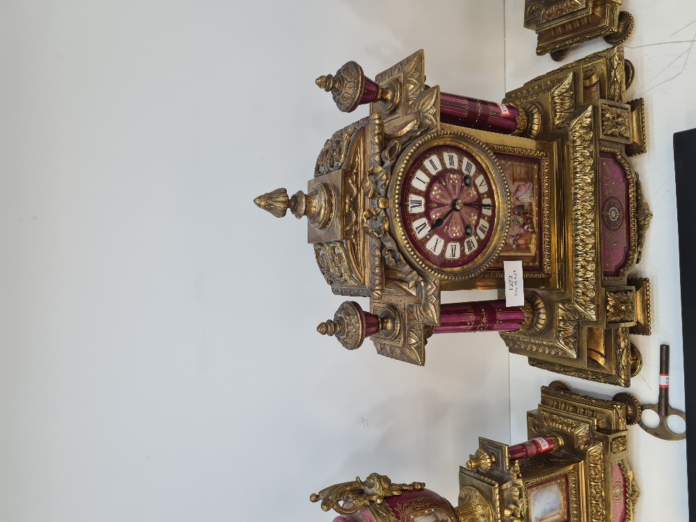 An early 20th Century French gilt metal clock garniture having porcelain panels decorated figures an - Image 6 of 6