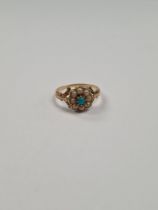 Antique yellow gold daisy ring with central turquoise surrounded seed pearls on foliate shoulders, u