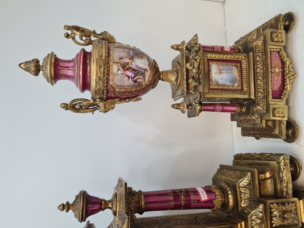 An early 20th Century French gilt metal clock garniture having porcelain panels decorated figures an - Image 4 of 6