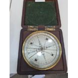 An early 19th Century compass by Troughton, London in mahogany fitted case, the dial 10cm