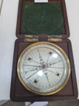 An early 19th Century compass by Troughton, London in mahogany fitted case, the dial 10cm