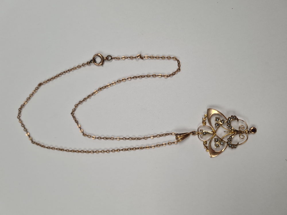 9ct yellow gold neckchain hung with an antique art nouveau design pendant set seed pearls and suspen