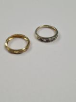 9ct yellow gold wedding band, with allover design, marked 375, size N and a 9ct gold band ring set a