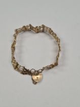 9ct yellow gold 4 bar gatelink bracelet with heart shaped clasp and safety chain, marked 375, Birmin