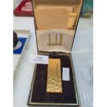 A Dunhill gold plated cigarette lighter in original case