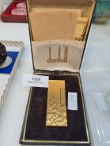 A Dunhill gold plated cigarette lighter in original case