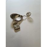 A silver spoon having spiral handle, a shell bowl. Also with a miniature Victorian Vinaigrette by Fr