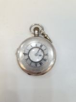 A silver half hunter pocket watch by Aaron Lufkin Dennison. The back having central vacant cartouche