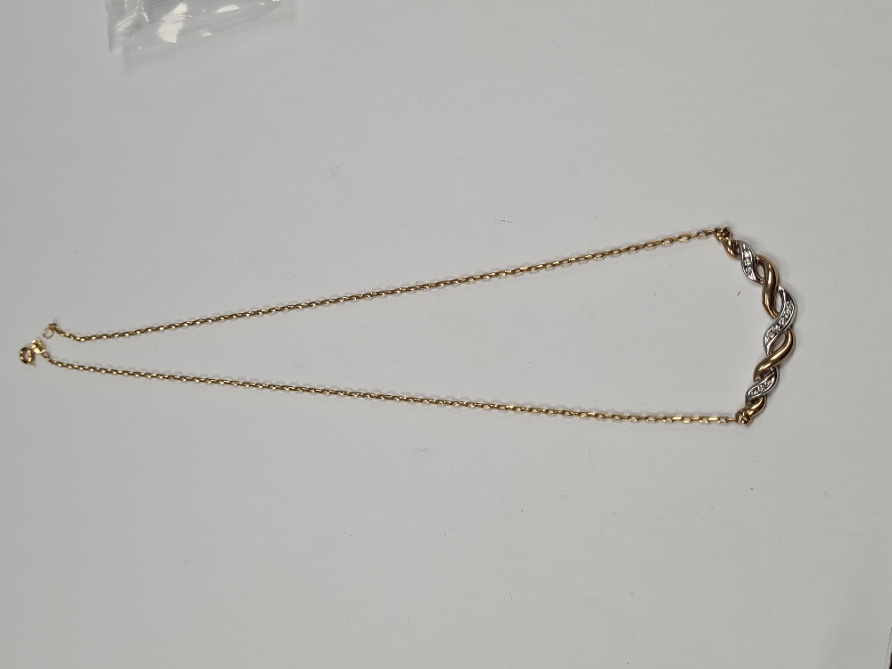 9ct yellow gold fine chain with two tone white and yellow gold cross over panel inset 11 graduating