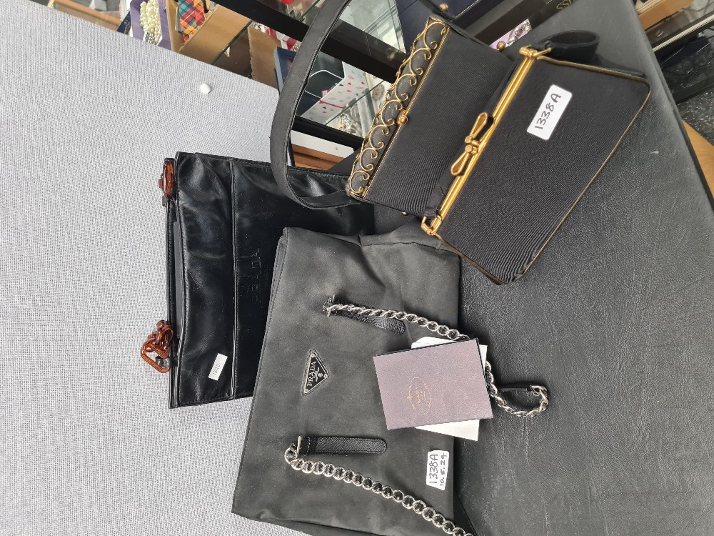 PRADA; A black PRADA ladies handbag with Certificate of Authenticity, plus two other small black eve