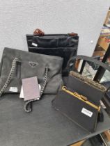 PRADA; A black PRADA ladies handbag with Certificate of Authenticity, plus two other small black eve