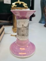 A German pink candlestick having oval panel of The Institute at Eastleigh
