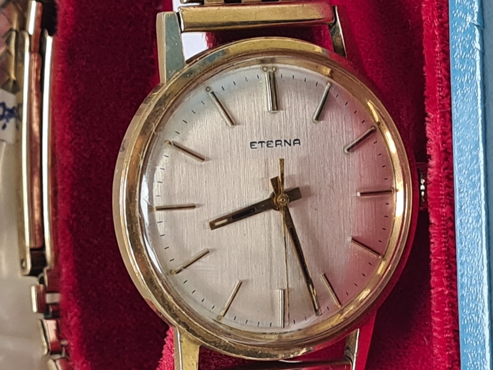 Eterna; A 9ct yellow gold gents Eterna watch on 9ct yellow gold strap, silvered dial, baton markers,
