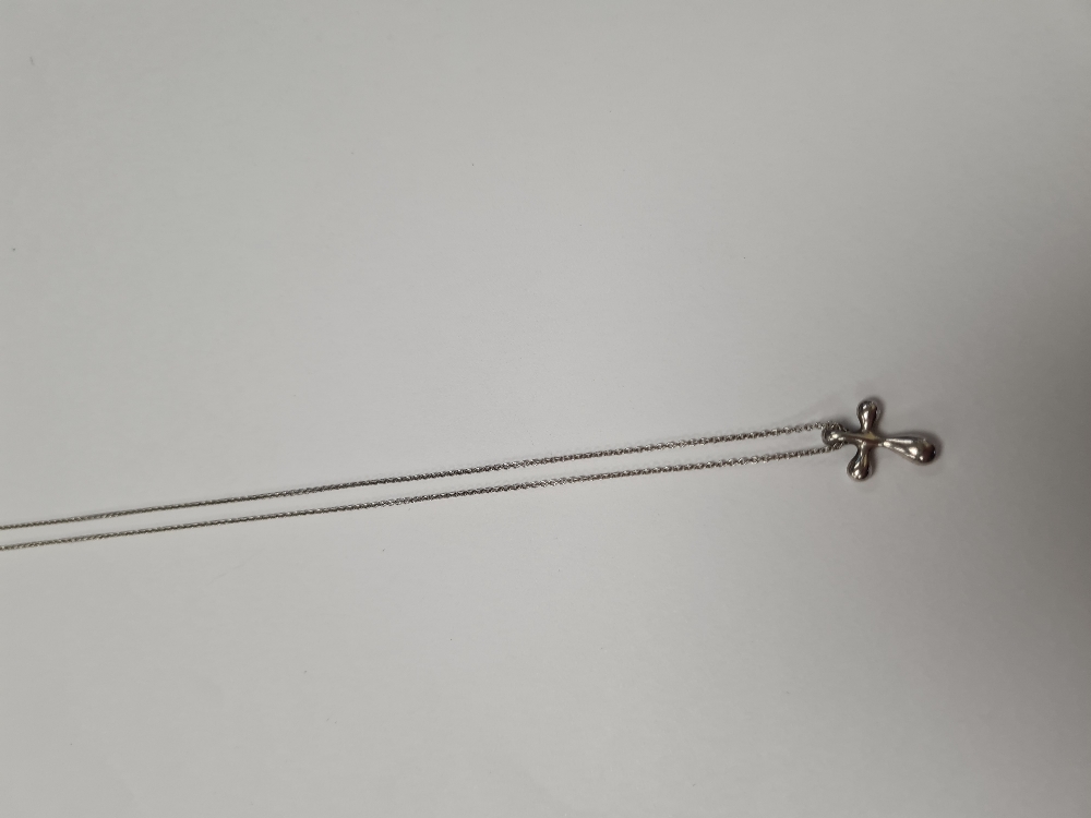Tiffany & Co; A Sterling Sivler neckchain hung with Elsa Peretti small silver cross? - Image 5 of 6