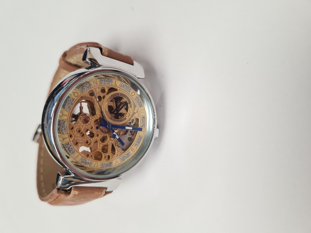 Louis Vuitton; A Louis Vuitton stainless steel skeleton watch, with golden works, blue hands 7347, o - Image 2 of 6