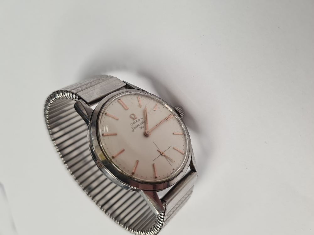 Omega; A vintage 'Omega' Seamaster 30 watch with cream dial and rose gold baton markers, hands and s - Image 5 of 5