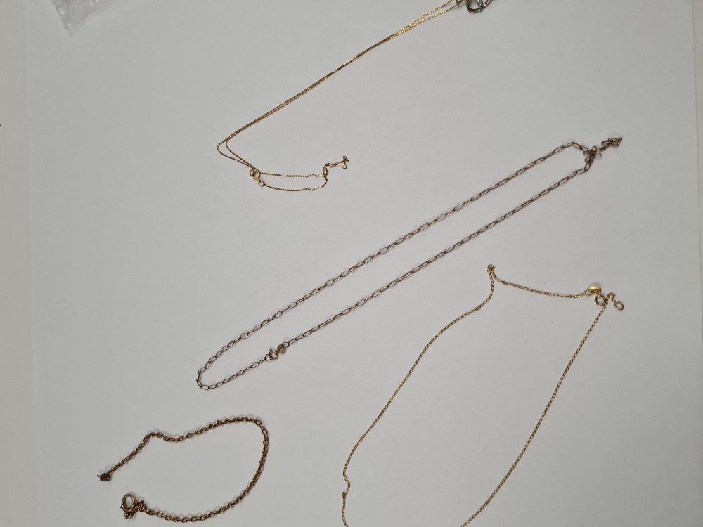 Four fine 9ct yellow gold chains, one hung with a heart shaped pendant set diamond
