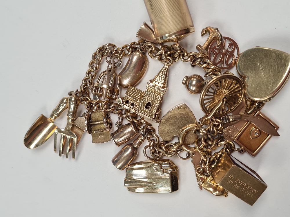 18ct gold bracelet hung with 23 charms, including 9ct and yellow metal, 9ct front and back locket, 9 - Image 3 of 4