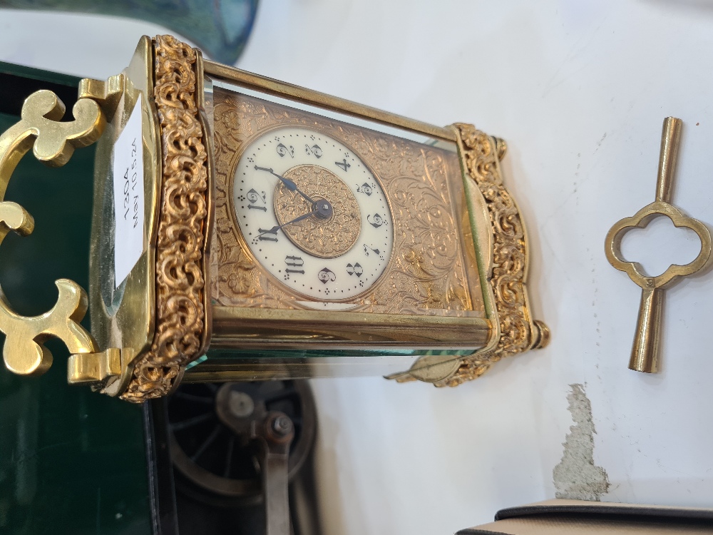 A French brass carriage clock having floral and scroll decoration - Image 4 of 4