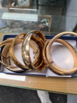 Six gold plated hinged bangles