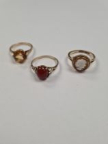 9ct Cameo dress ring, with twisted frame, red cabouchon hard stone 9ct gold ring and a 9ct gold face