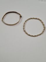 Two 9ct yellow gold bangles, both AF, one unmarked, hinged example marked 375, approx 9.4g