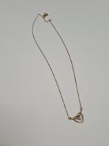 9ct yellow gold fine chain with a panel in the form of a heart inset 3 small diamonds, marked 375, a