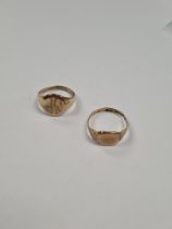 Two 9ct yellow gold signet rings, one with an oval initialled panel, the other tapered square, both