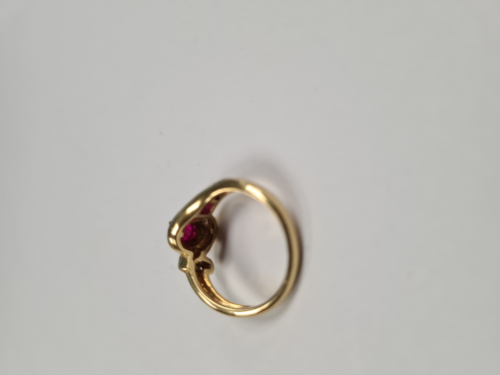 18ct yellow gold ruby and diamond crossover design dress ring, set central oval cut ruby, surrounded - Image 5 of 5