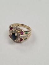 9ct yellow gold multi-gem set ring set 3 clusters of gems, ruby, emerald and sapphires on foliate pa