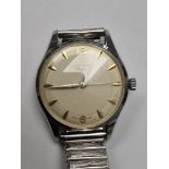 Longines; a gents stainless steel Longines wristwatch with champagne dial, golden baton markers, num