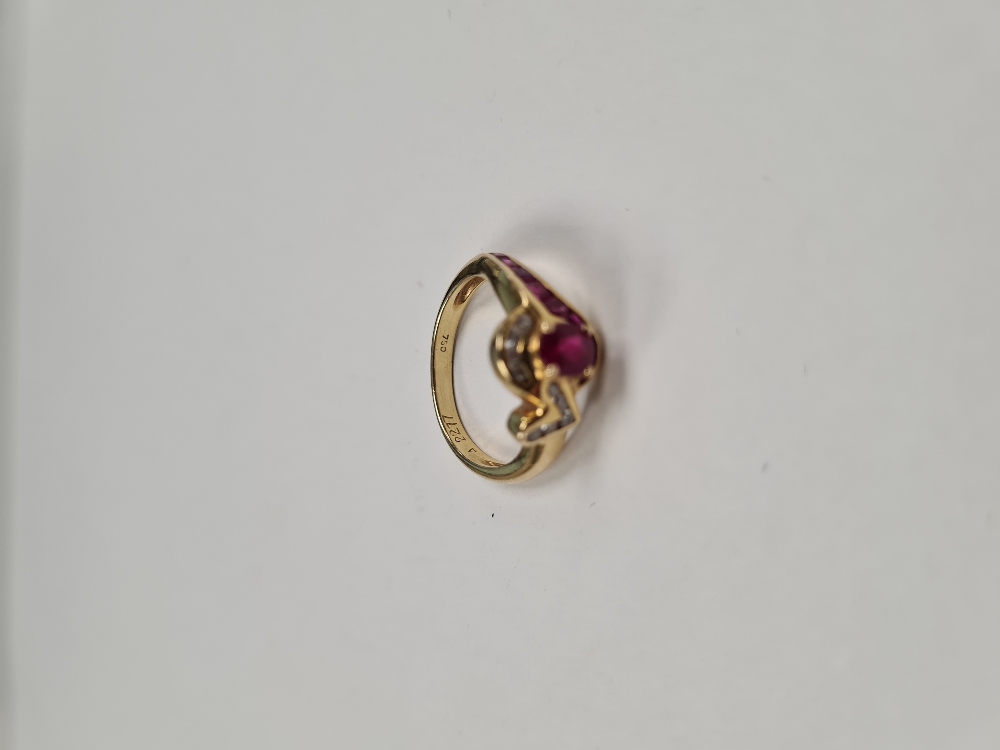 18ct yellow gold ruby and diamond crossover design dress ring, set central oval cut ruby, surrounded - Image 2 of 5