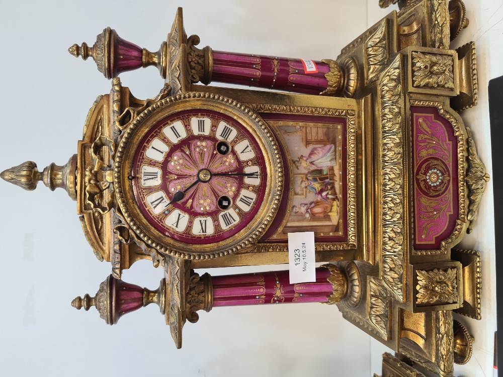 An early 20th Century French gilt metal clock garniture having porcelain panels decorated figures an - Image 2 of 6