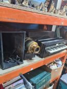 A Victorian ebonised piano accordion and an incomplete magic lantern both with cases