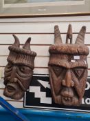 Two similar 20th Century carved African face masks