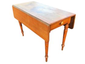 A Victorian mahogany pembroke table, the chamfered rectangular top with two leaves opening on