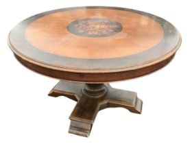 A Victorian style circular mahogany dining table, the moulded crossbanded top with central floral