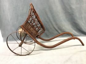 A miniature toypony trap, the cane basket with bentwood shaft supports, raised on wrought iron
