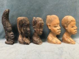 Two pairs of African carved hardwood male and female busts; a single head with elaborate