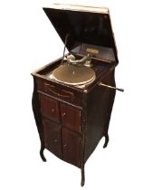 A mahogany cased Fulltone wind-up gramophone, the bombé shaped Hepplewhite style cabinet with