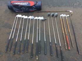 Three old hickory shafted golf clubs; a set of 13 Donnay golf clubs, complete with bag; and a