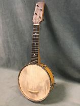 An ash and chromed metal banjolele, the resonator with parchment head and decorative chromed back,