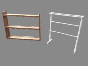 A Yorkshire arts & crafts style hanging rack, the shelves with wavy aprons flanked by shaped sides -