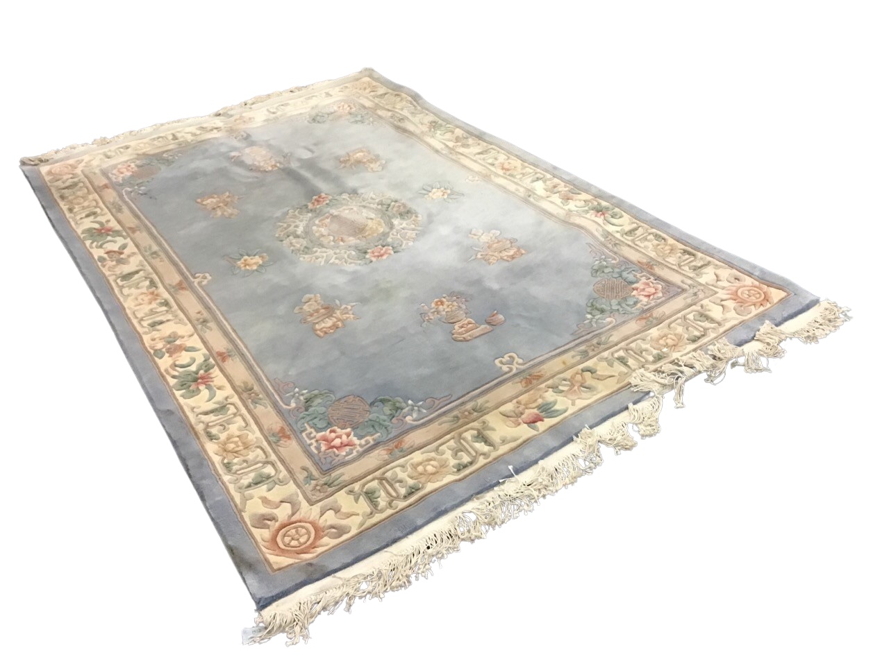 A Chinese thick pile wool carpet, the pale blue field centered by a shou symbol and floral