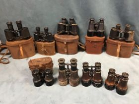 Six leather cased pairs of binoculars - Hunsicker & Alexis of Paris, Dollond, a military pair with