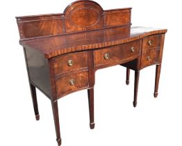 A late nineteenth century serpentine shaped mahogany sideboard, the arched panelled back with