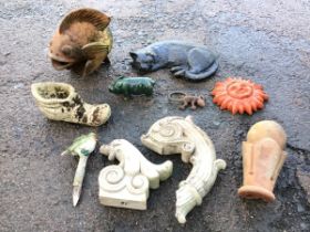 Miscellaneous garden ornaments - a terracotta fish, a green glazed pig, a cast iron lizard, a